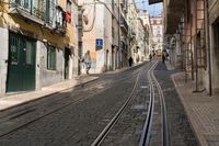 an image of a street in europe where the tracks are not parallel at all points