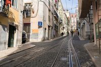 an image of a street in europe where the tracks are not parallel at all points