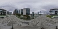 a circular image of buildings from the ground to the sky shows a curving angle as well