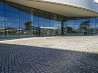 an image of a building that is very reflective in the glass window of it's front