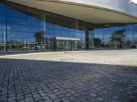 an image of a building that is very reflective in the glass window of it's front