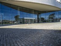 an image of a building that is very reflective in the glass window of it's front