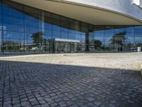 an image of a building that is very reflective in the glass window of it's front