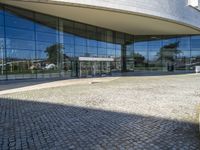 an image of a building that is very reflective in the glass window of it's front