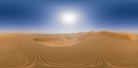 an artistic photograph of sand dune dunes in the sahara, morocco, looking towards the setting sun