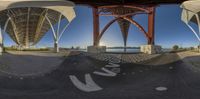 two 360 - images of the underside of a long bridge and the surrounding area underneath it