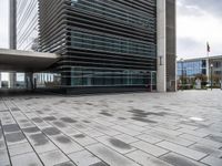 a street view of the buildings and sidewalk at an office district in london, england