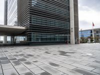 a street view of the buildings and sidewalk at an office district in london, england