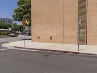 a stop sign is on the side of the street next to a building with a stop sign at it