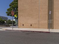 a stop sign is on the side of the street next to a building with a stop sign at it