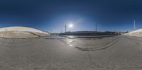 the view of a parking lot from above, taken by the fish - eye lens