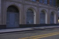 an image of a fire hydrant sitting in the grass outside of an apartment complex