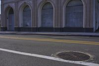 an image of a fire hydrant sitting in the grass outside of an apartment complex