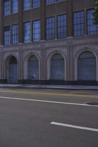 an image of a fire hydrant sitting in the grass outside of an apartment complex