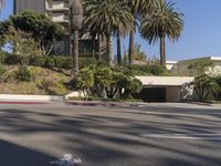 the intersection where there is a parking garage on the side of the road on top of a building