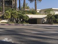 the intersection where there is a parking garage on the side of the road on top of a building