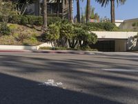 the intersection where there is a parking garage on the side of the road on top of a building