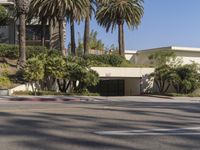 the intersection where there is a parking garage on the side of the road on top of a building