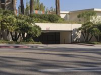 the intersection where there is a parking garage on the side of the road on top of a building