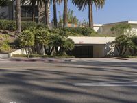 the intersection where there is a parking garage on the side of the road on top of a building