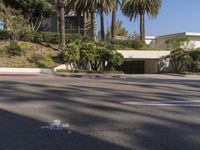 the intersection where there is a parking garage on the side of the road on top of a building