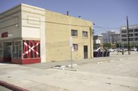 a business called axx with signs on the side of the road next to it