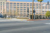 large, very large building with many windows on it's sides, and one large sign says work