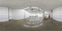 a 360 - fisheye view shows the interior of a building with white walls and vaulted ceilings