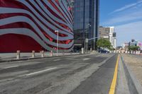 a person is riding a bike on a city street in front of an american flag