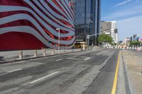 a person is riding a bike on a city street in front of an american flag