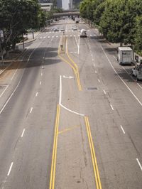 a lone highway with lines and markings that look like road work, in the afternoon