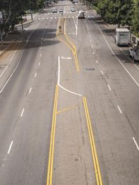 a lone highway with lines and markings that look like road work, in the afternoon