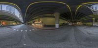 a 360 - view camera shows the intersection with many arches and floors above a city street