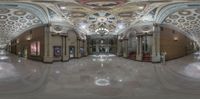 a panorama photo taken of the inside of a store lobby with marble floors and ceiling with intricate designs