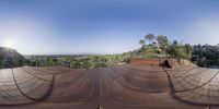 the view from a house with a ramp on top of it, while another is looking out the window