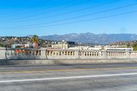 this is the city in california from on an overpass over the road, overlooking a mountainous city