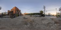 a fish eye lens of an empty street and house with a parking lot and stairs on it