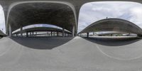 several different views of a car park with a road passing under it and people on bikes and cars