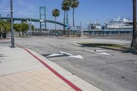 the crosswalk is empty and has several signs on it for pedestrians to know where it is