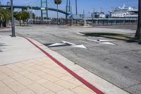 the crosswalk is empty and has several signs on it for pedestrians to know where it is