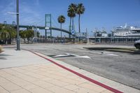 the crosswalk is empty and has several signs on it for pedestrians to know where it is