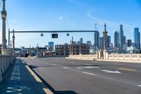 a picture of the city and an intersection on a busy city street, one way traffic signal with traffic in view