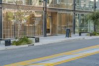 there are two empty sidewalks on the sidewalk near a store in a big city