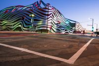 the building is decorated with some art and stripes, including stripes and shapes that give the appearance