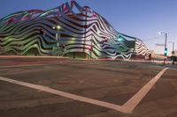 the building is decorated with some art and stripes, including stripes and shapes that give the appearance