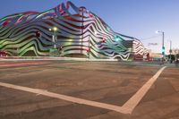 the building is decorated with some art and stripes, including stripes and shapes that give the appearance