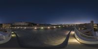 this is an image of the city at night time from a skateboard park at night