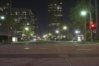 a city street is dark with low light traffic at night, but no one can see