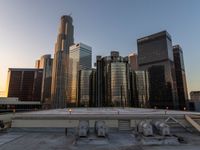 the city skyline from above a rooftop in chicago, illinois, united states with skyscrapers and glass buildings