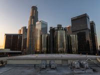 the city skyline from above a rooftop in chicago, illinois, united states with skyscrapers and glass buildings